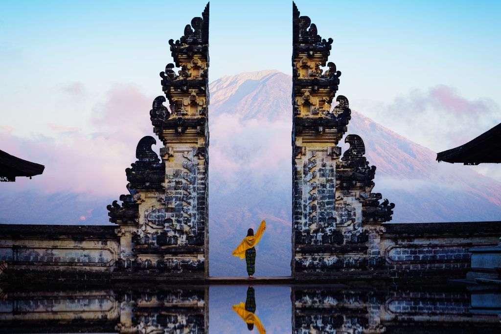 women standing between Penataran Lempuyang